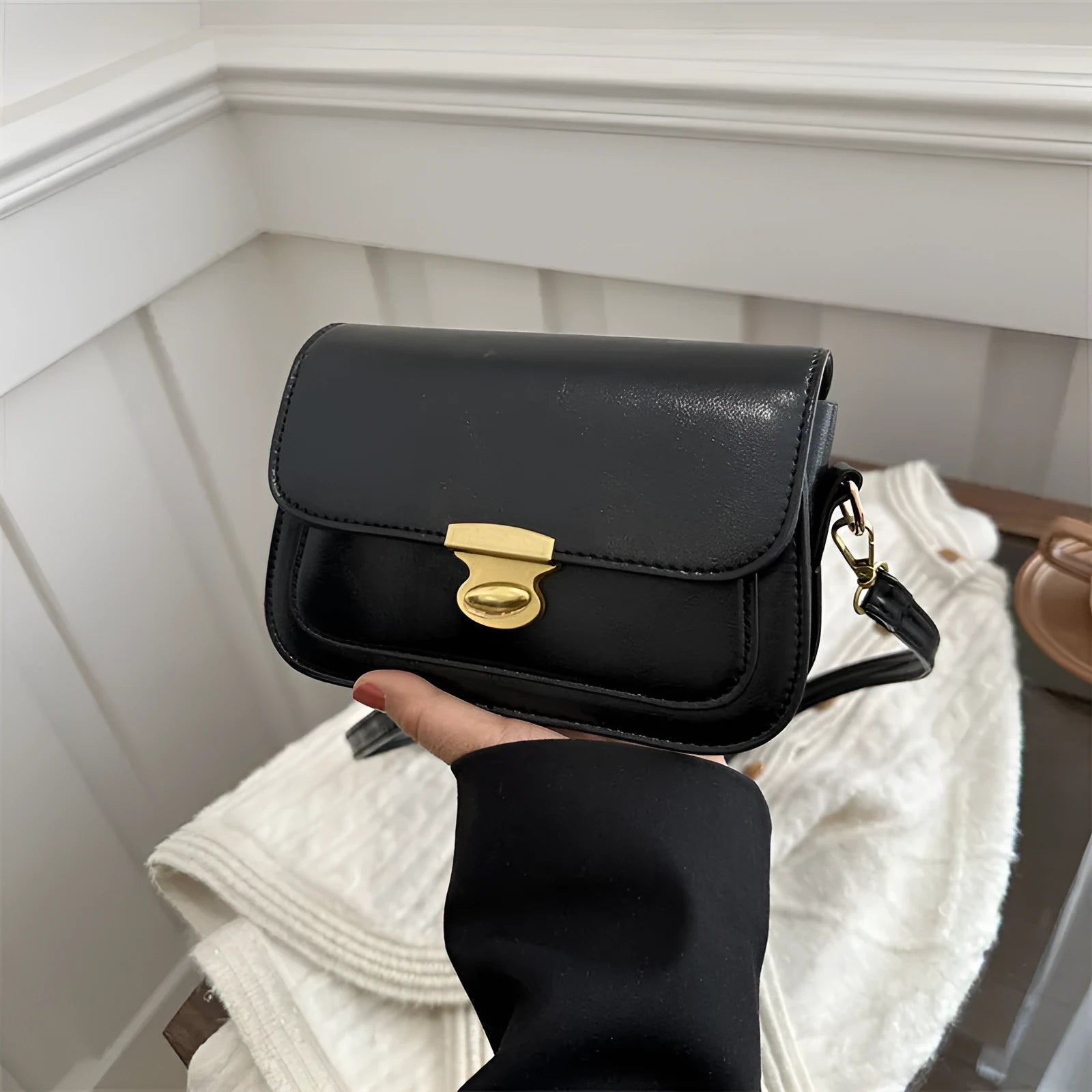 Soft PU leather small square handbag in horizontal rectangle shape shown in brown colour.