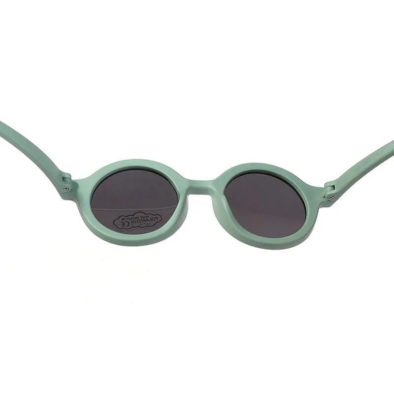 Children's silicone sunglasses with round full frame, UV400 polarised TAC lenses, and flexible TPEE construction for 0-3 year olds
