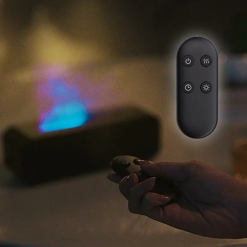 Black and white flame dynamic aroma diffuser with remote control on a wooden table