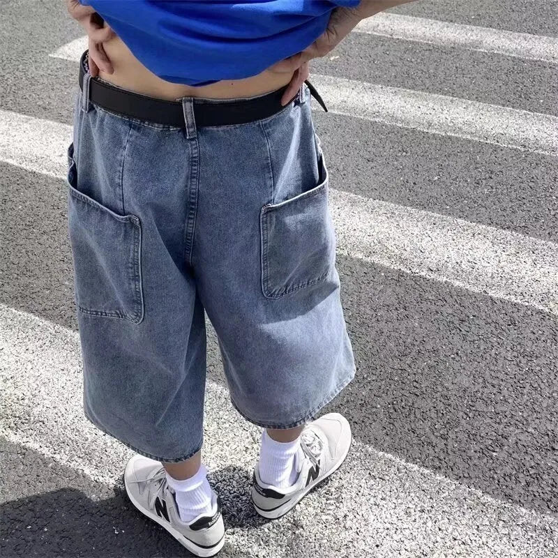 Men's blue thin denim pirate shorts with a high waist and cropped length on a hanger.