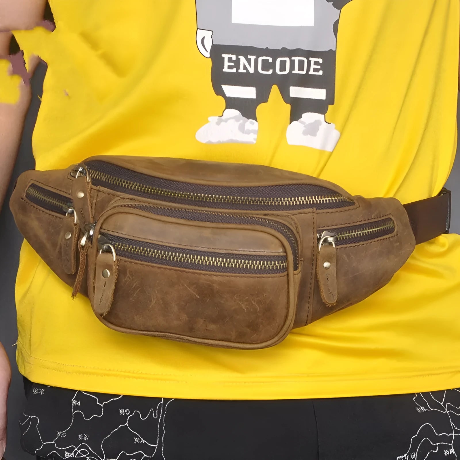 Brown leather retro messenger bag with shoulder strap showing front flap and buckle.