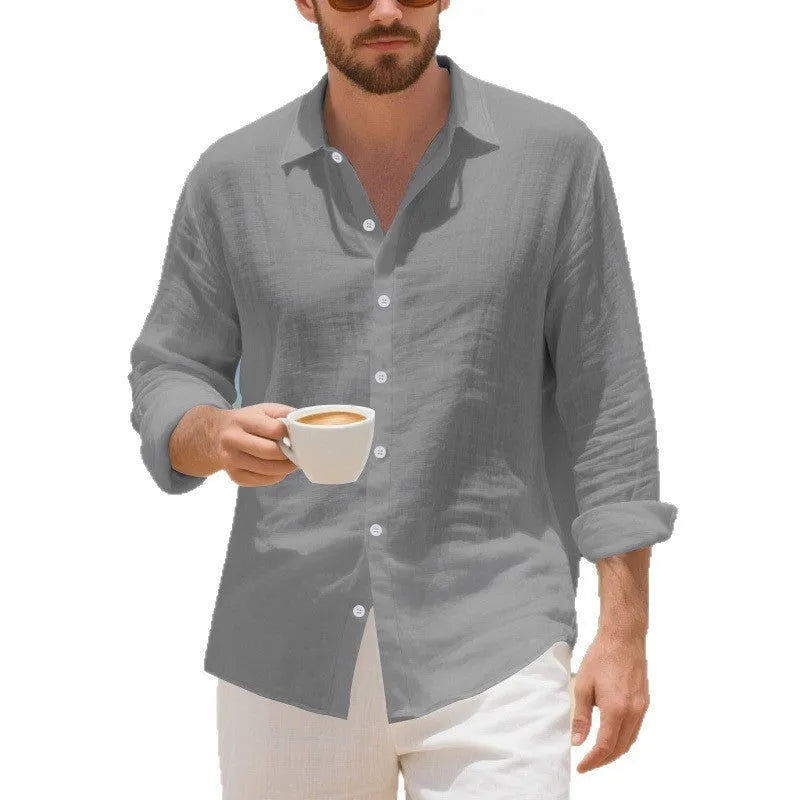 Linen casual shirt in a loose American fit on a hanger, shown in an earthy yellow colour.