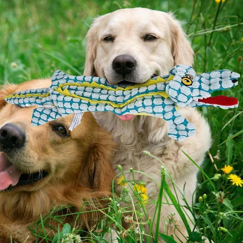 Crocodile-shaped plush dog toy with corduroy fabric detailing and squeaker inside