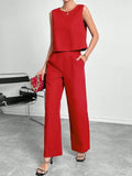 Women's red polyester two-piece set with sleeveless round-neck top and wide-leg trousers laid flat.