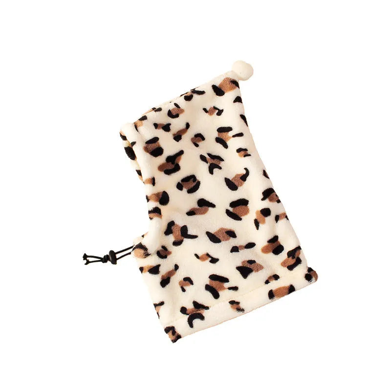 A cloth bear and rabbit ears headdress for pets in leopard print, black, and red colours.