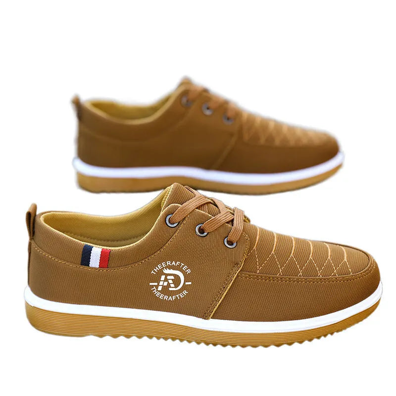 Men's black canvas casual work shoes with a non-slip sole and leather toe cap on a white background.