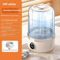 Small white portable washing machine with USB cable on a countertop.