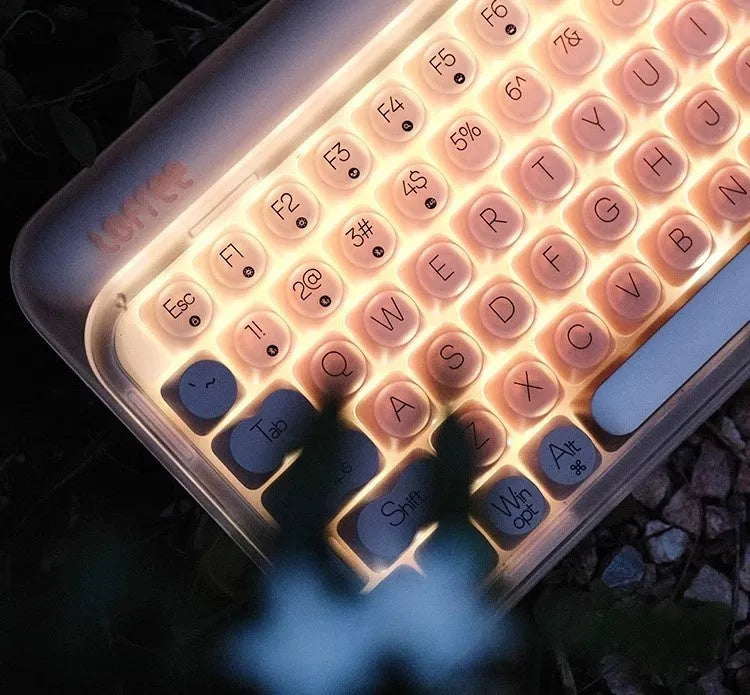 Liquid foundation wireless mechanical keyboard bundle with mouse, light, and calculator on desk