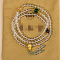 White crystal geometric bead 108 rosary bracelet laid flat, showcasing its unisex ethnic style design.