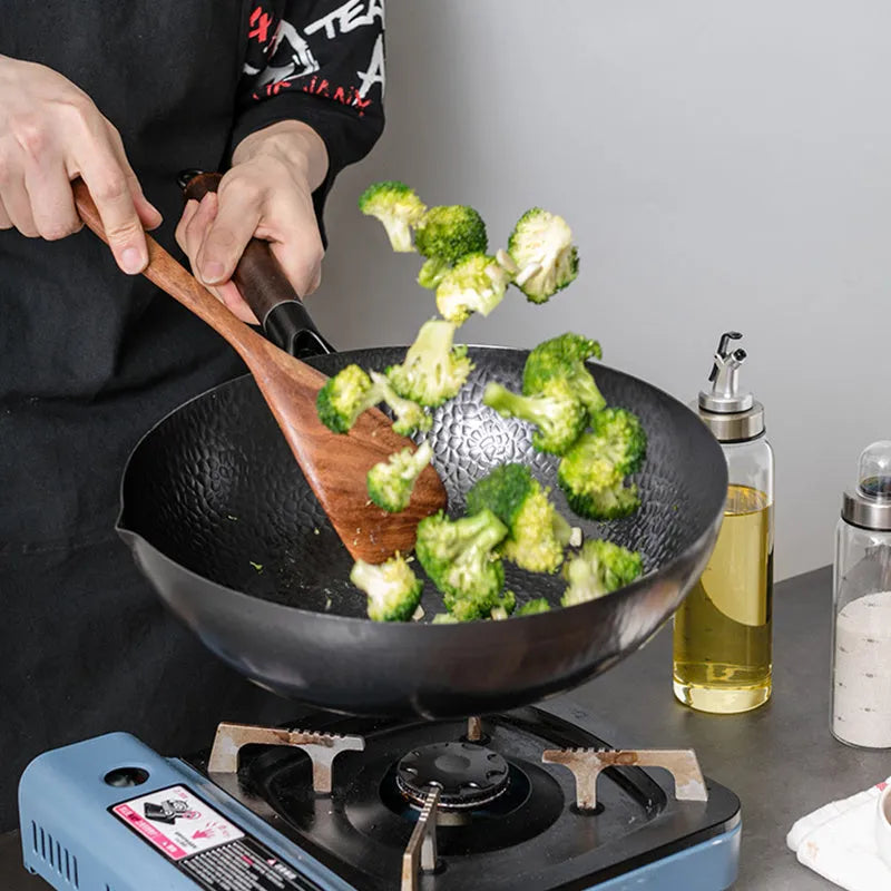 Traditional black iron wok with wooden handle showing 40cm diameter cooking surface