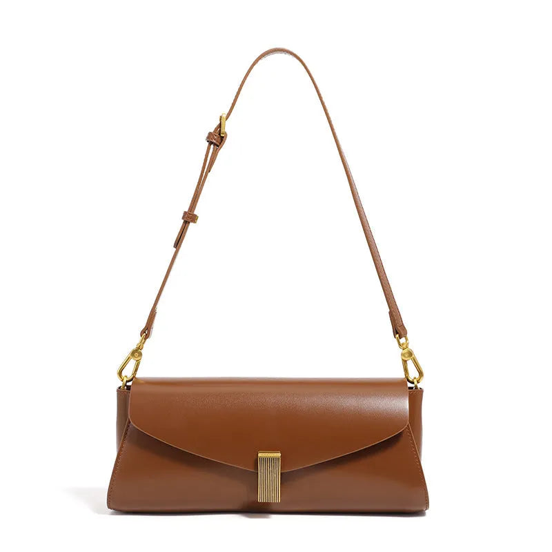 Women's cowhide leather cross-body bag in pillow shape with clamshell opening