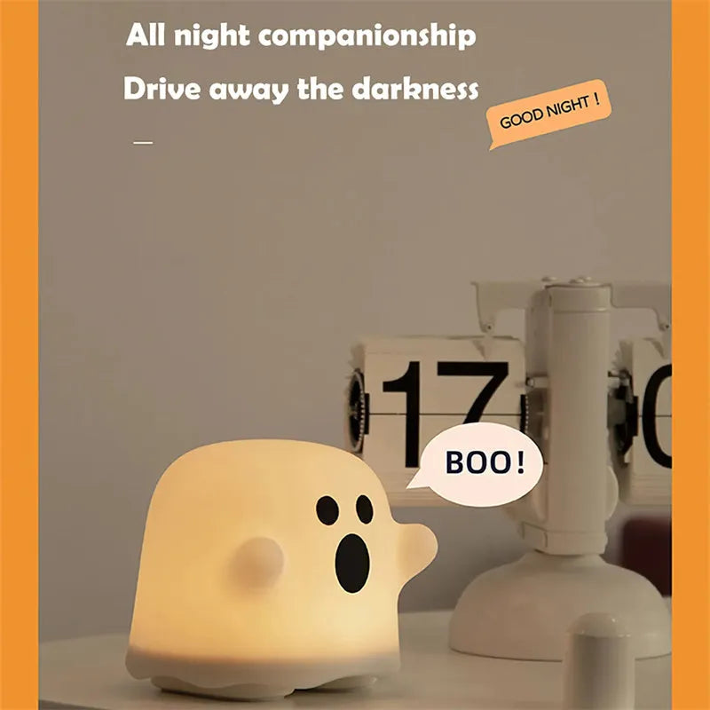 White portable LED touch sensor night light on a wooden bedside table.