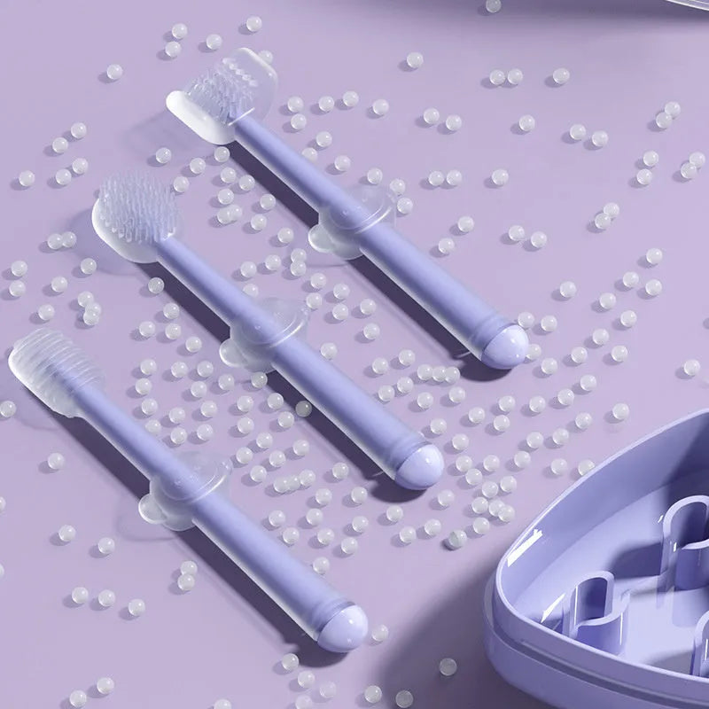 Silicone pet toothbrush for dogs and cats in blue, green, and purple colours on a white background.