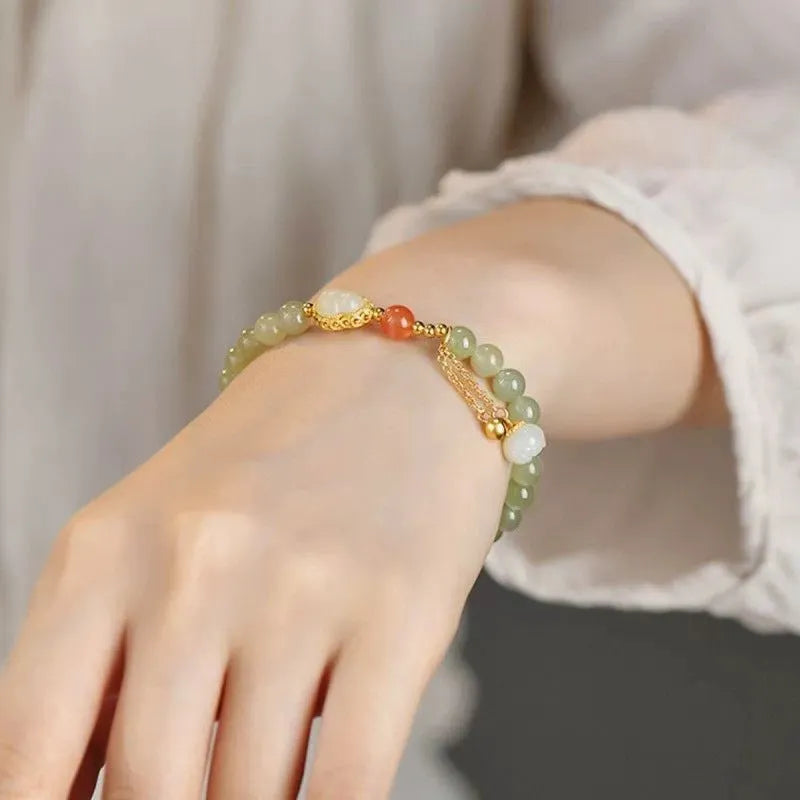 Jade women's bracelet with gold plated gourd charm and fu character decoration