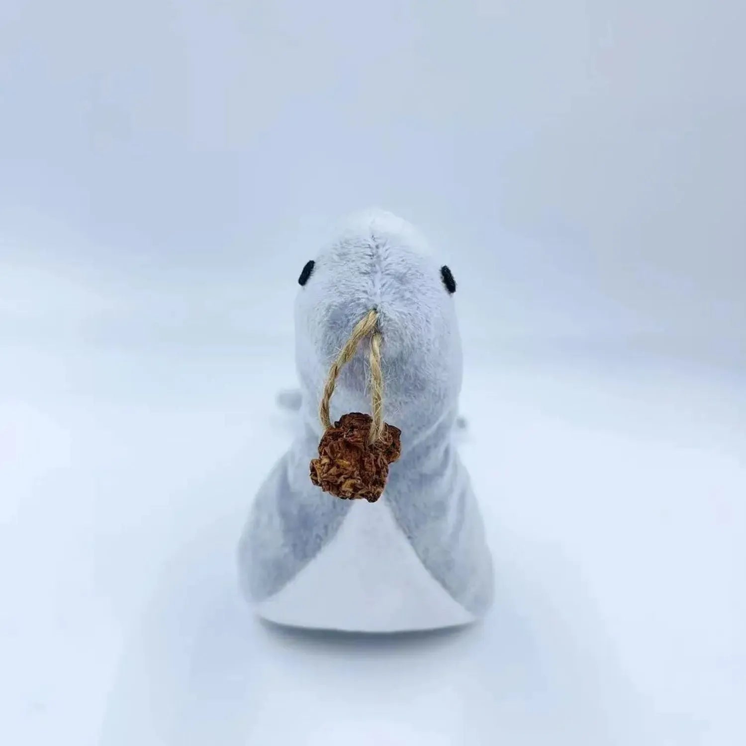 Blue sea lion plush cat toy with bell sound, catnip filling and gall fruit grinding surface