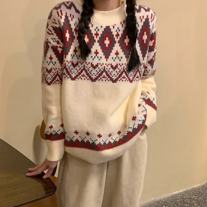 Red and white striped loose-fit long sleeve pullover knitted top on a hanger.