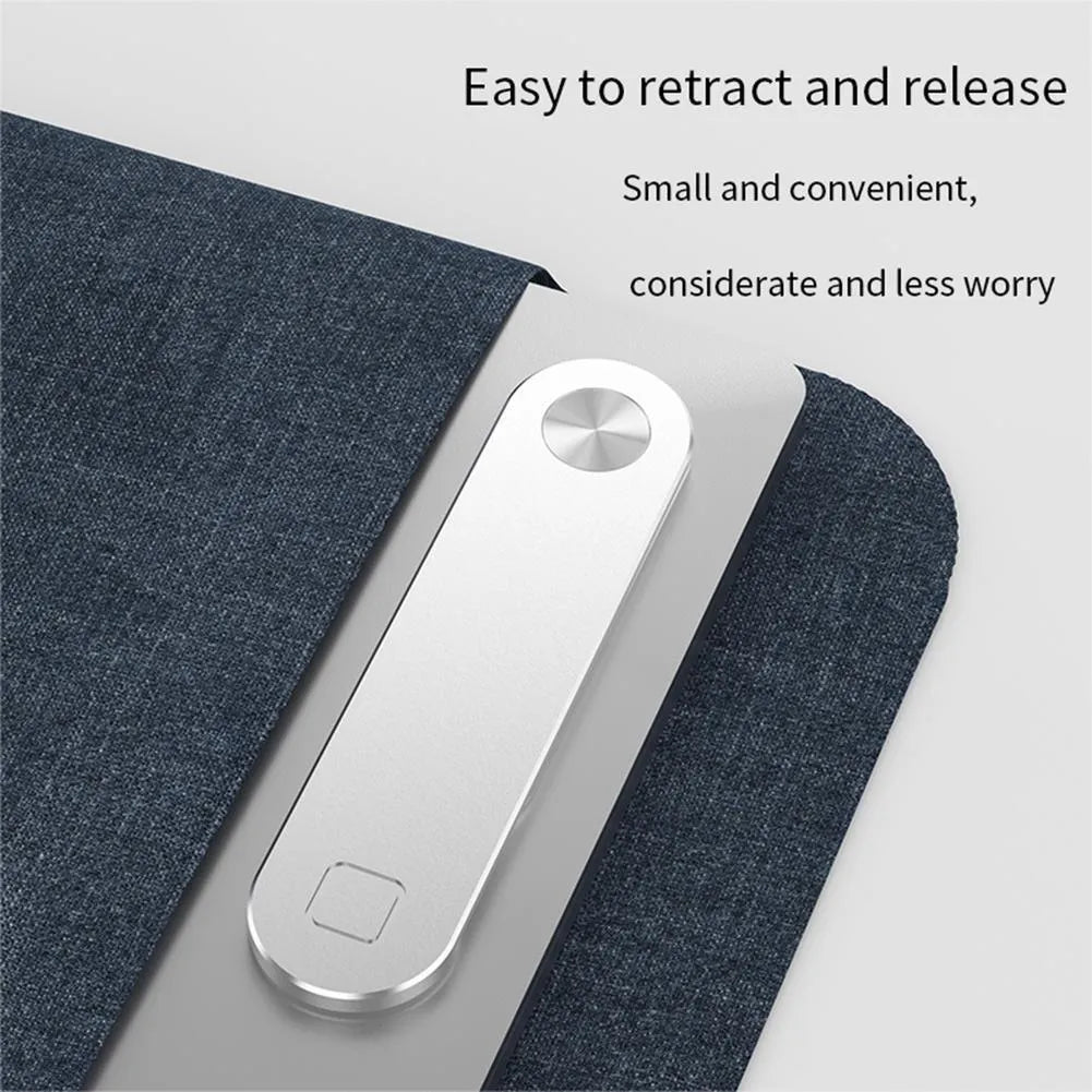 Black aluminium magnetic phone holder clipped to the side of a silver laptop