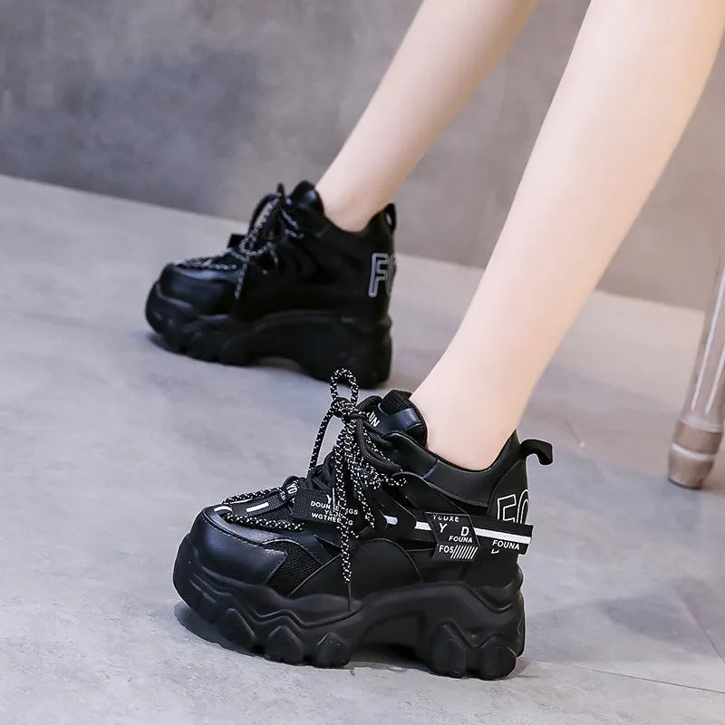 Women's white mesh platform sports shoes with a cross strap and rubber sole.