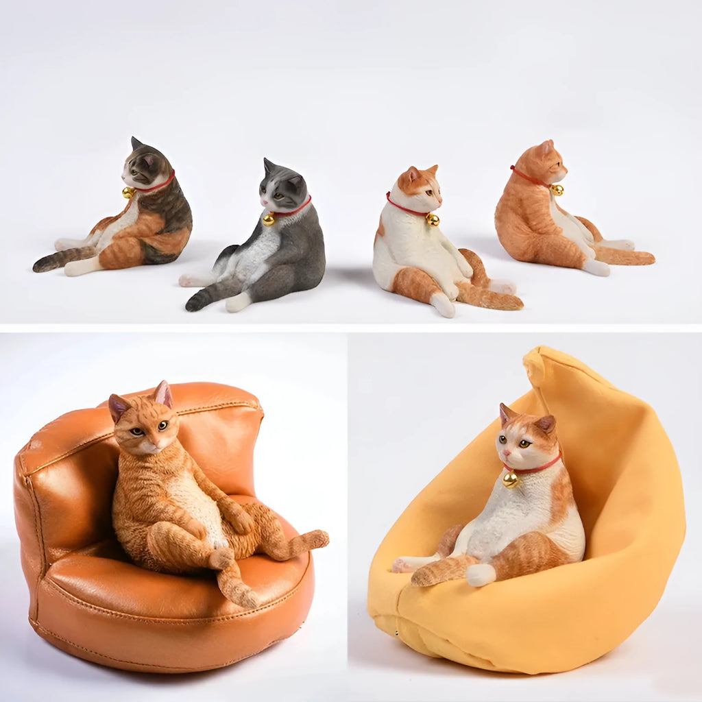 Lazy cat and sofa miniature car dashboard ornament made from resin, approximately 7.5cm high.