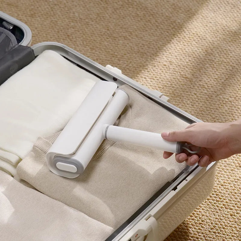Refillable lint remover roller for picking up cat hair from floors and carpets