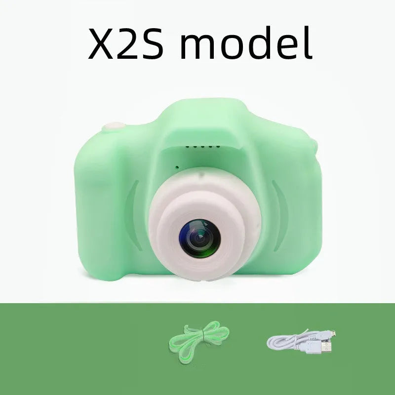 X2 HD mini cartoon kids digital camera in silicone body with 2-inch screen and lanyard.