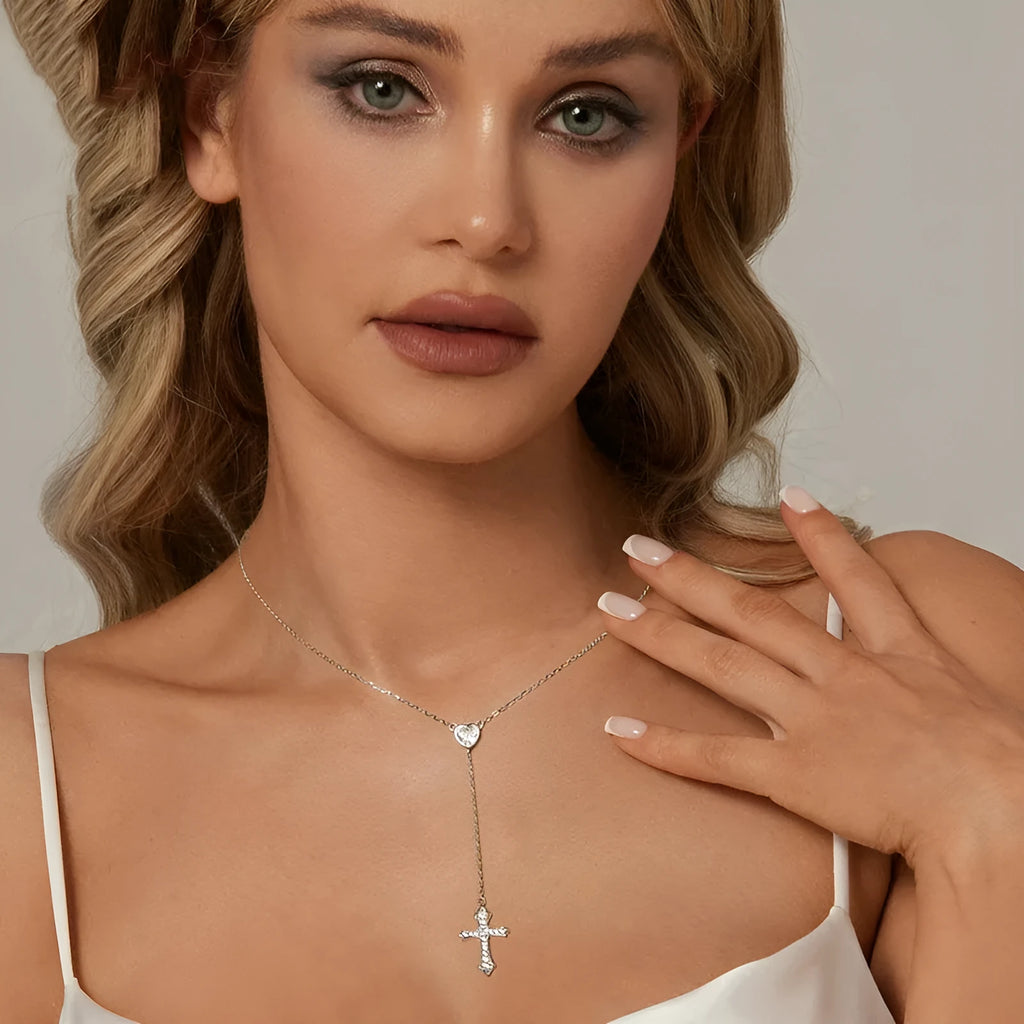 Silver love cross necklace on an O-ring chain with a V-neck design, colour BSN384.
