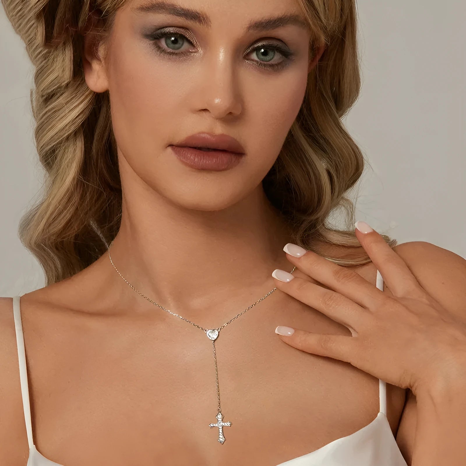 Silver love cross necklace on an O-ring chain with a V-neck design, colour BSN384.