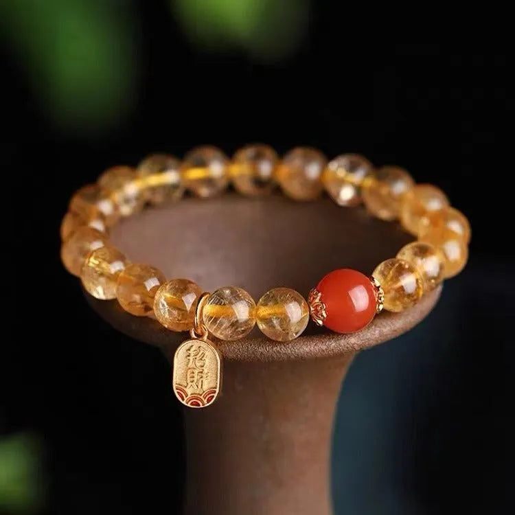 Polished red agate bead bracelet showing gold ruby colour, offered in 6mm, 8mm and 10mm bead sizes.