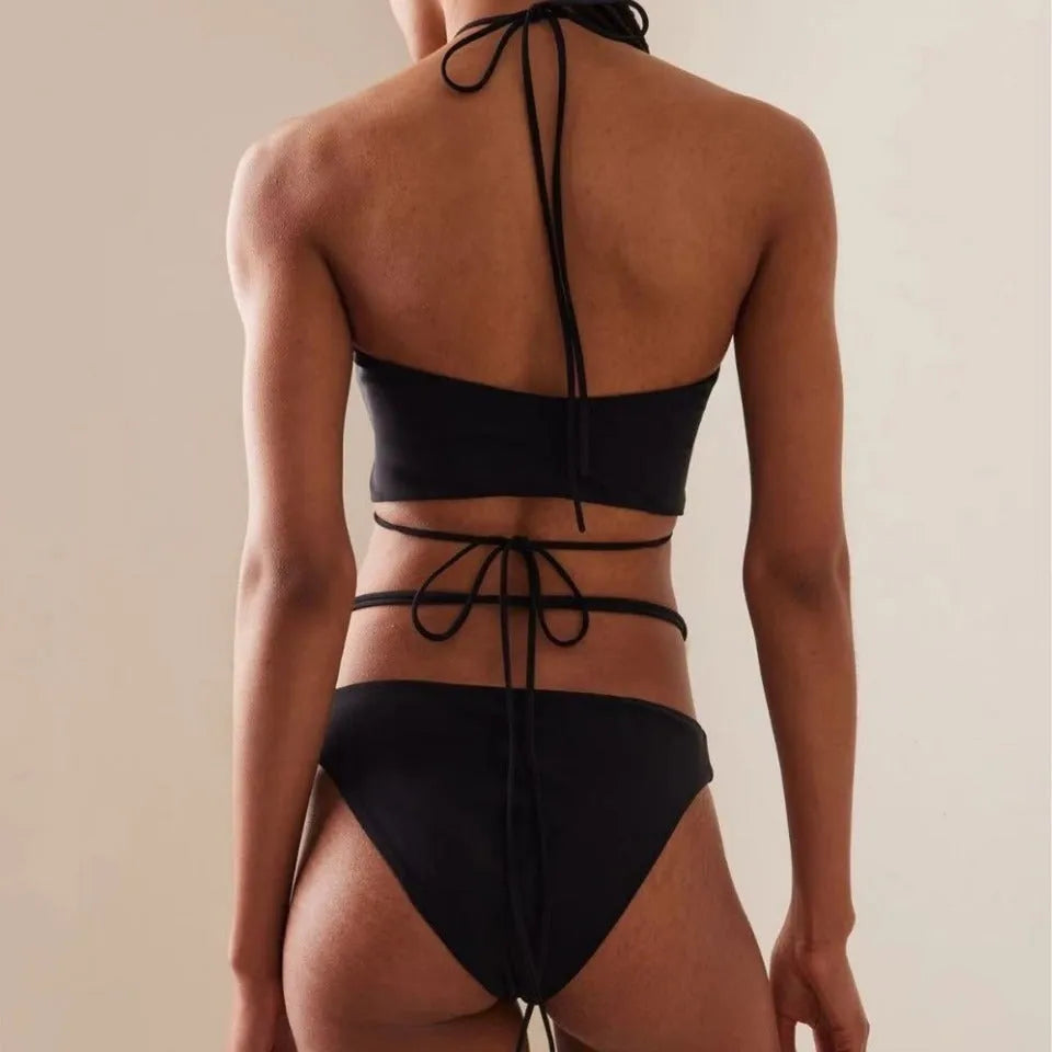 Women's black lace-up bikini swimsuit with adjustable design and quick-drying nylon fabric