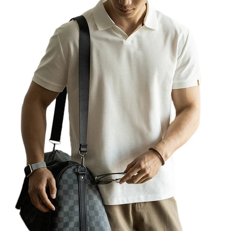 American-style short-sleeved polo shirt in blue on hanger showing regular fit and cotton blend fabric.