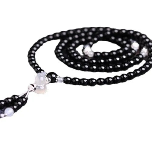 Black agate stone bead bracelet with 108 geometrically shaped beads and number element details