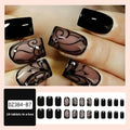 Dark Ins style black vine wearable nail tips set with jelly glue finish on a white background