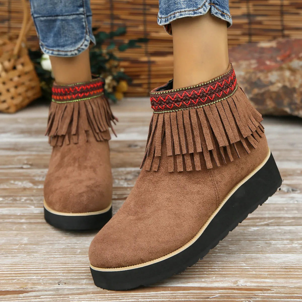 Women's dark brown suede wedge ankle boot with side zipper, tassel, and thick waterproof platform sole.