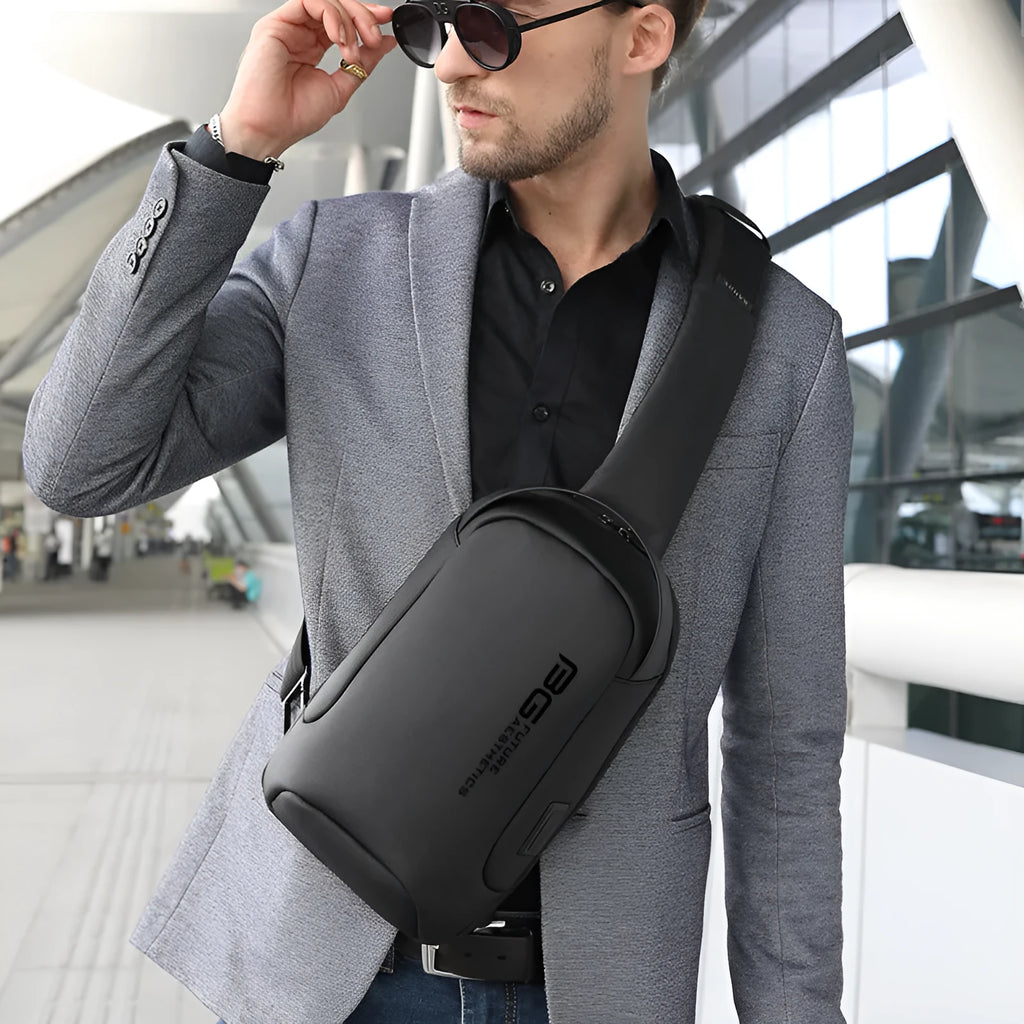 Men's oxford cloth shoulder bag with USB charging port in blue colour with letter pattern design