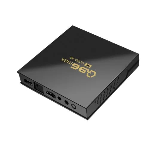 Q96 MAX S905 Android 4K TV Box set-top unit with remote control on a table.