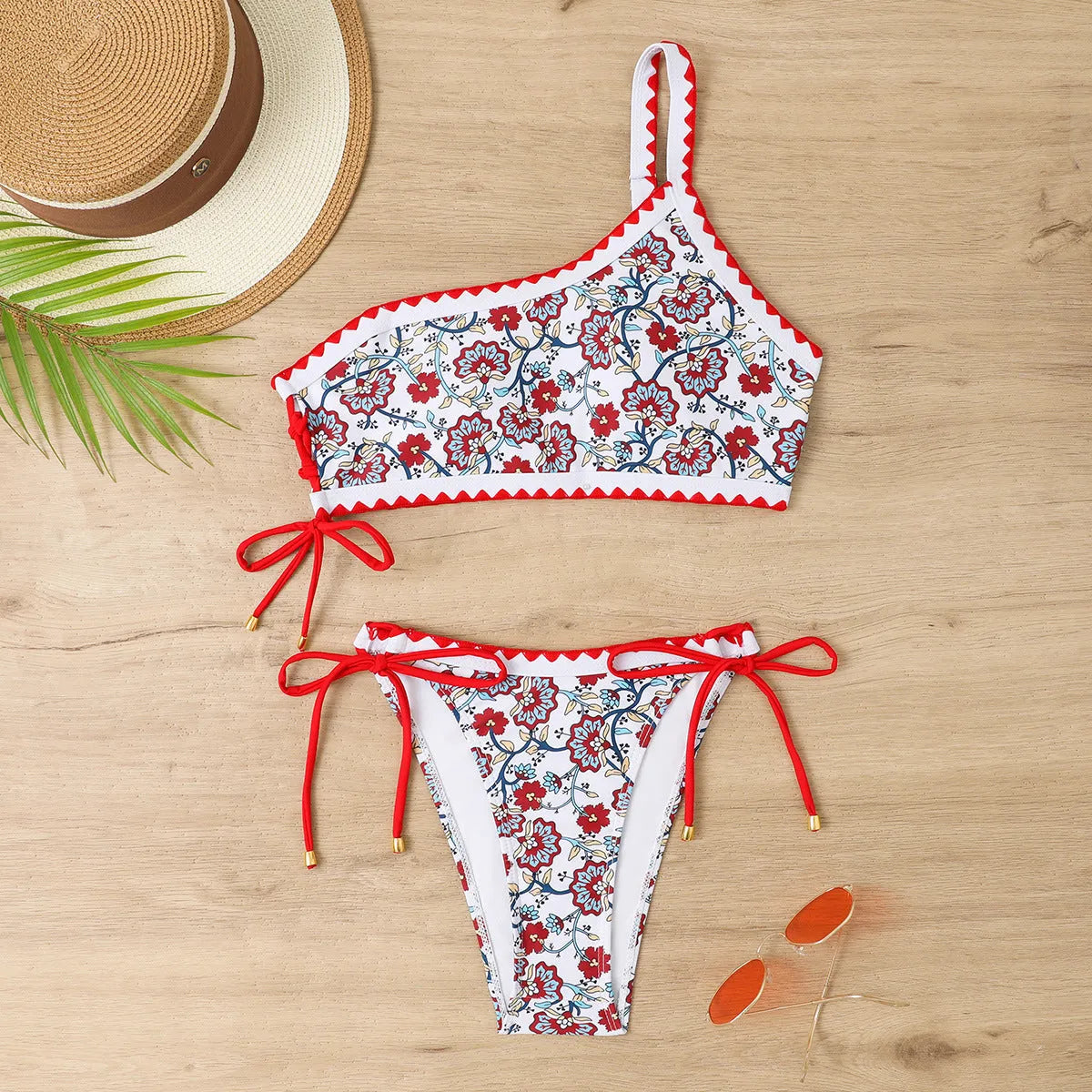 Blue one-shoulder floral bikini set for women on a mannequin