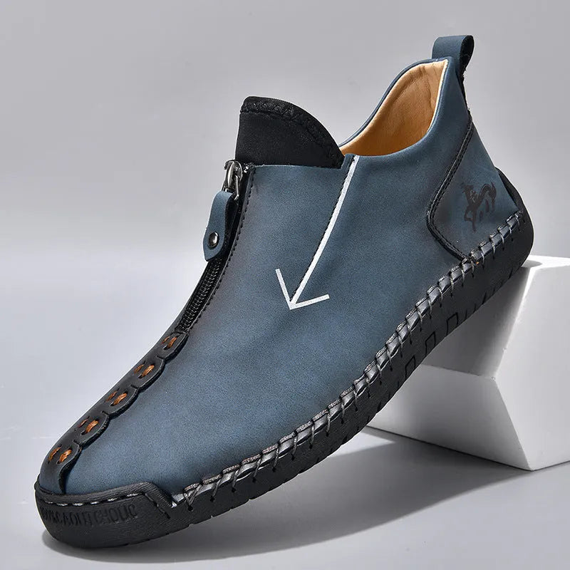 Men's black leather ankle boots with front zipper and round toe on rubber sole