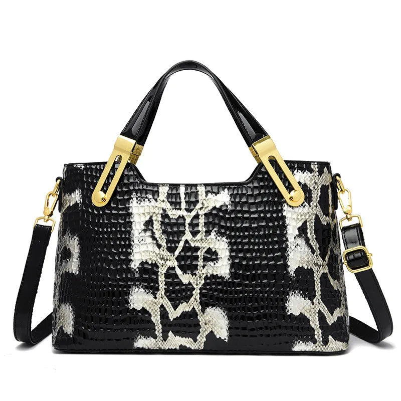 Retro black and white messenger bags with chain detail, showing internal phone and file compartments.