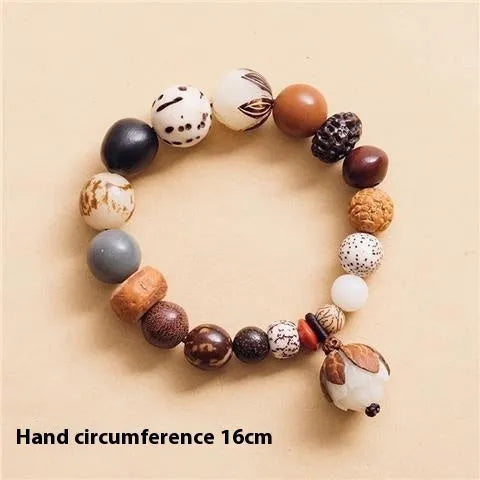 Handmade rudraksha bead bracelet with 18 seeds on a string, showing 16 cm loop.