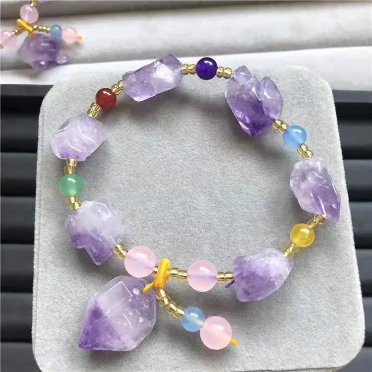 Natural style amethyst bead bracelet for women with a fu character charm.