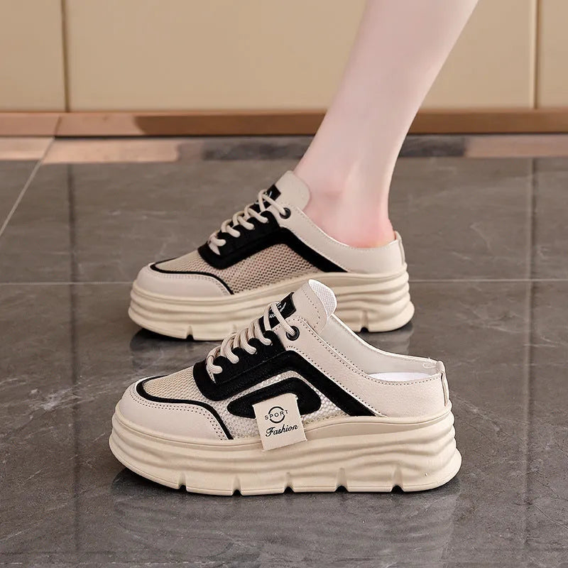 Women's mesh half slippers in black with height-increasing insoles and round toe design