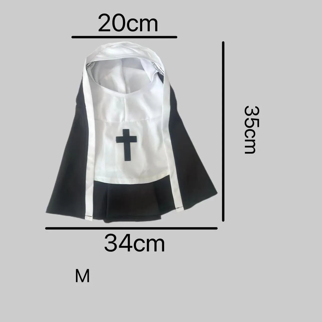 Black and white nun costume cloak outfit on a small or medium dog for Halloween.