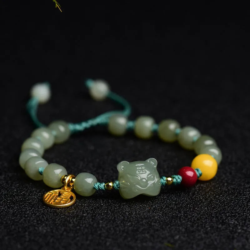 Natural Hetian Jade bracelet with cinnabar and beeswax beads, showing Zodiac modelling on 5x7mm beads.