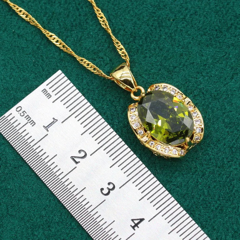 Olive green and red zircon jewellery set for women featuring a necklace with snake bone chain, matching earrings, and a ring.