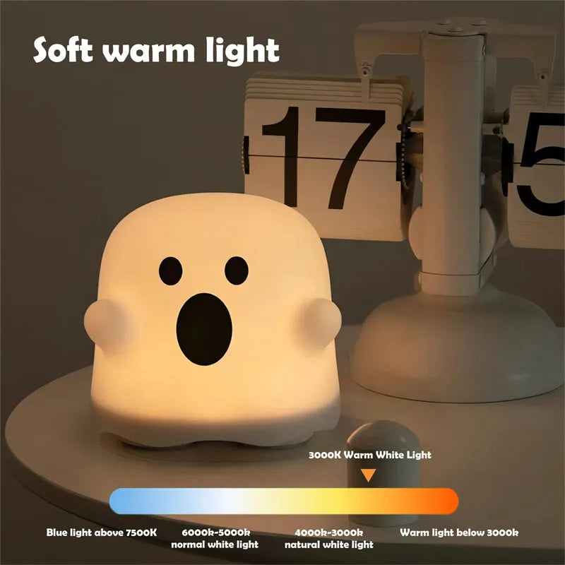 White portable LED touch sensor night light on a wooden bedside table.