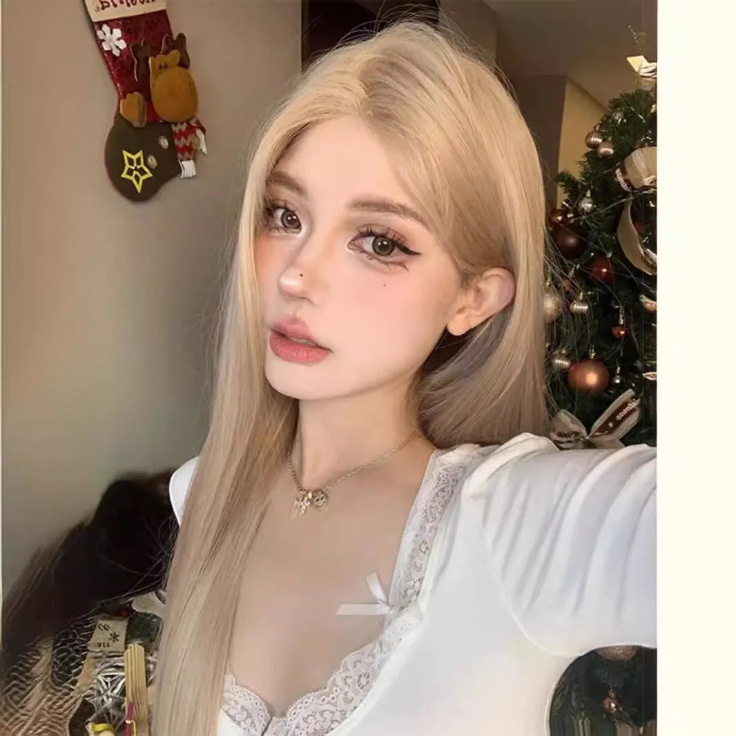 Women's long straight milk tea blonde wig on a stand with hair net.