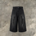 Men's black denim shorts with red flame embroidery patch on leg