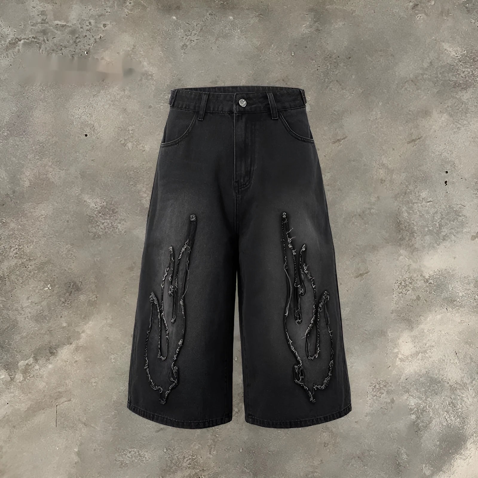 Men's black denim shorts with red flame embroidery patch on leg