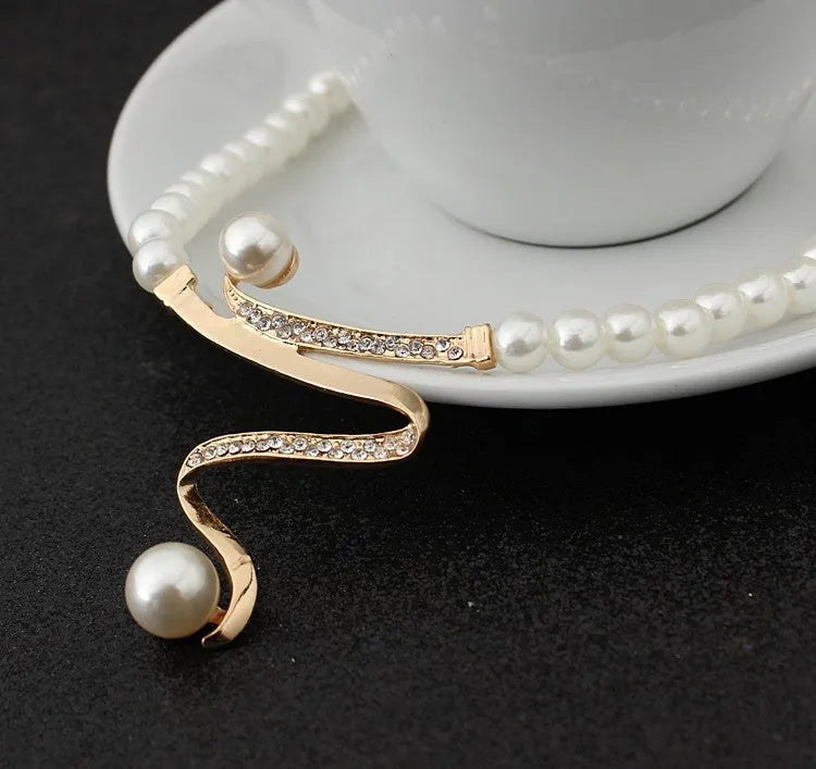 Gold electroplated pearl style necklace and earrings set with deep V clavicle design and drop pendant