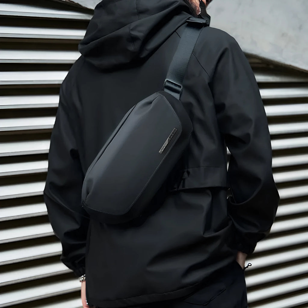 Black men's messenger bag with Oxford cloth construction for one-shoulder riding